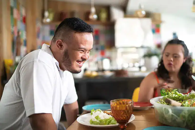 Empowering Weight Loss: A Comprehensive Guide for Individuals with Disabilities 2 Image of a disabled man and balance around nutrition to aid weight loss Walton on the Hill