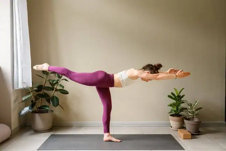 Achieving the Perfect Tone: How Often Should You Exercise for Results? 1 Woman doing Yoga exercise Walton on the Hill to help with toning the body.