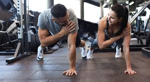 Sculpting Sleek Arms: The Essential Role of Cardio in Toning Without Bulking Up 1 Image of man and woman doing Cardio Walton on the Hill to tone their arms.
